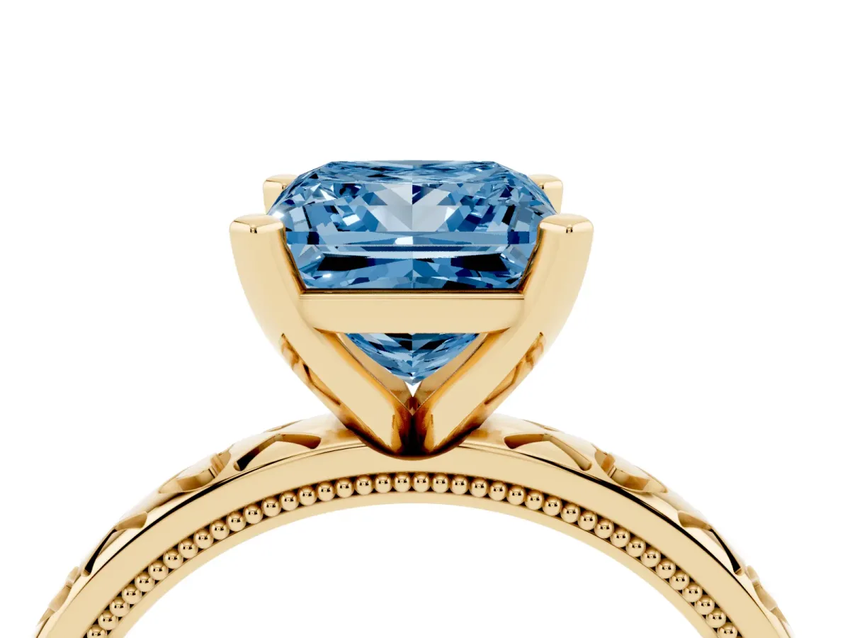 Fancy Blue Princess Cut Solitaire Diamond Engagement Ring with XO Engraved Band and Four-Prong Setting Yellow gold