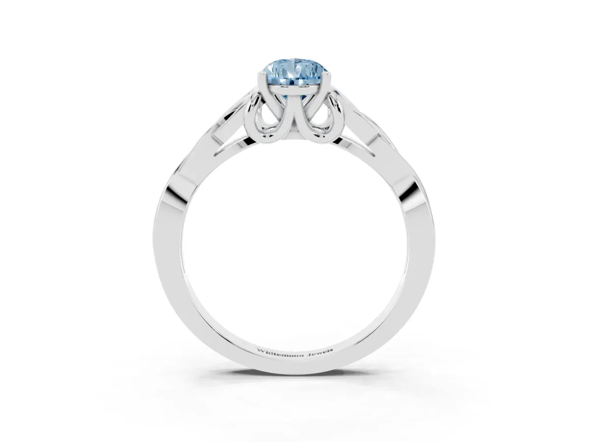Fancy Blue Pear Cut Diamond Solitaire Engagement Ring with Celtic Knot Band and Four-Prong Setting Silver