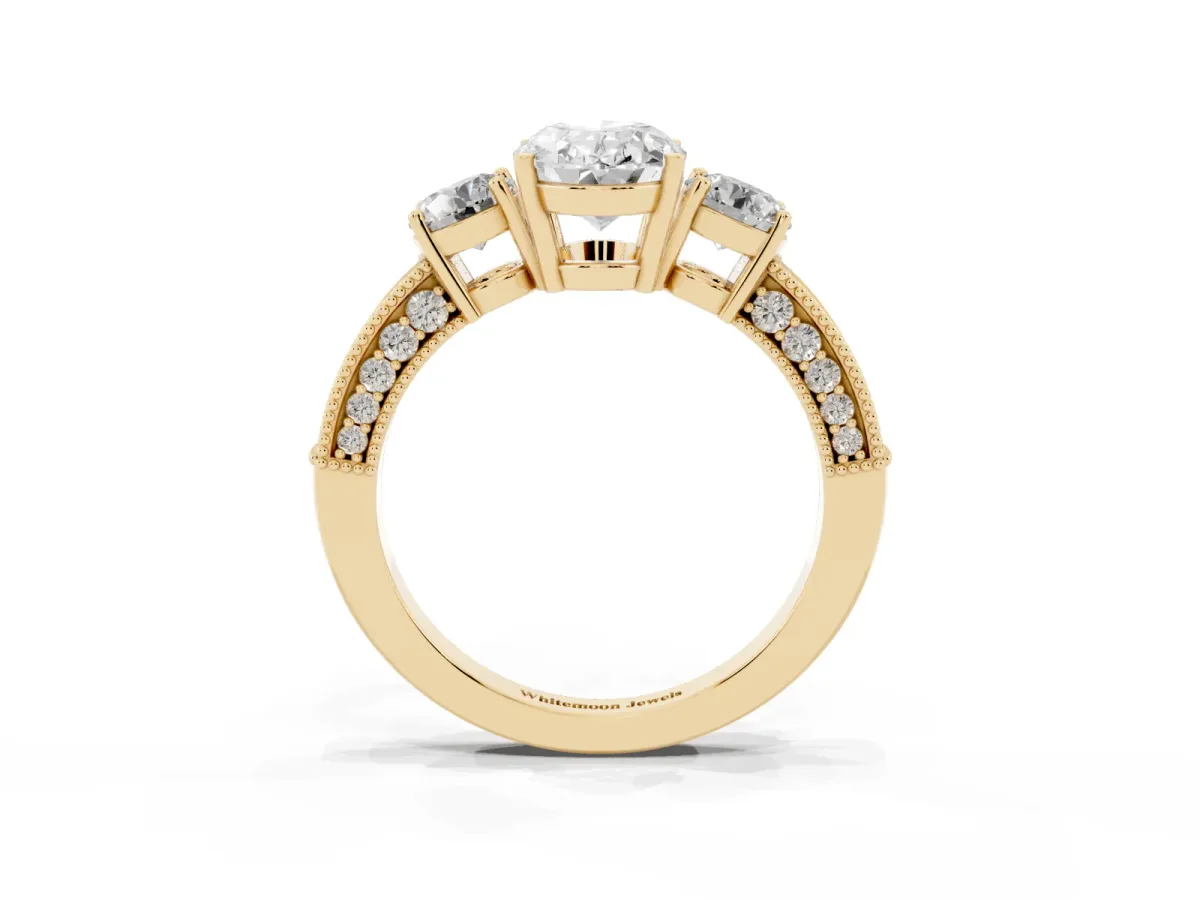 Oval Cut Three-Stone Diamond Ring with Pavé Band and Four-Prong Setting Yellow gold