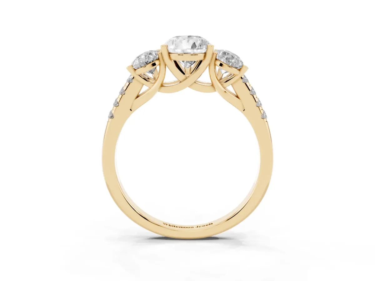 Three-Stone Pear Cut Diamond Ring with Round Pavé Band and Prong Setting Yellow gold