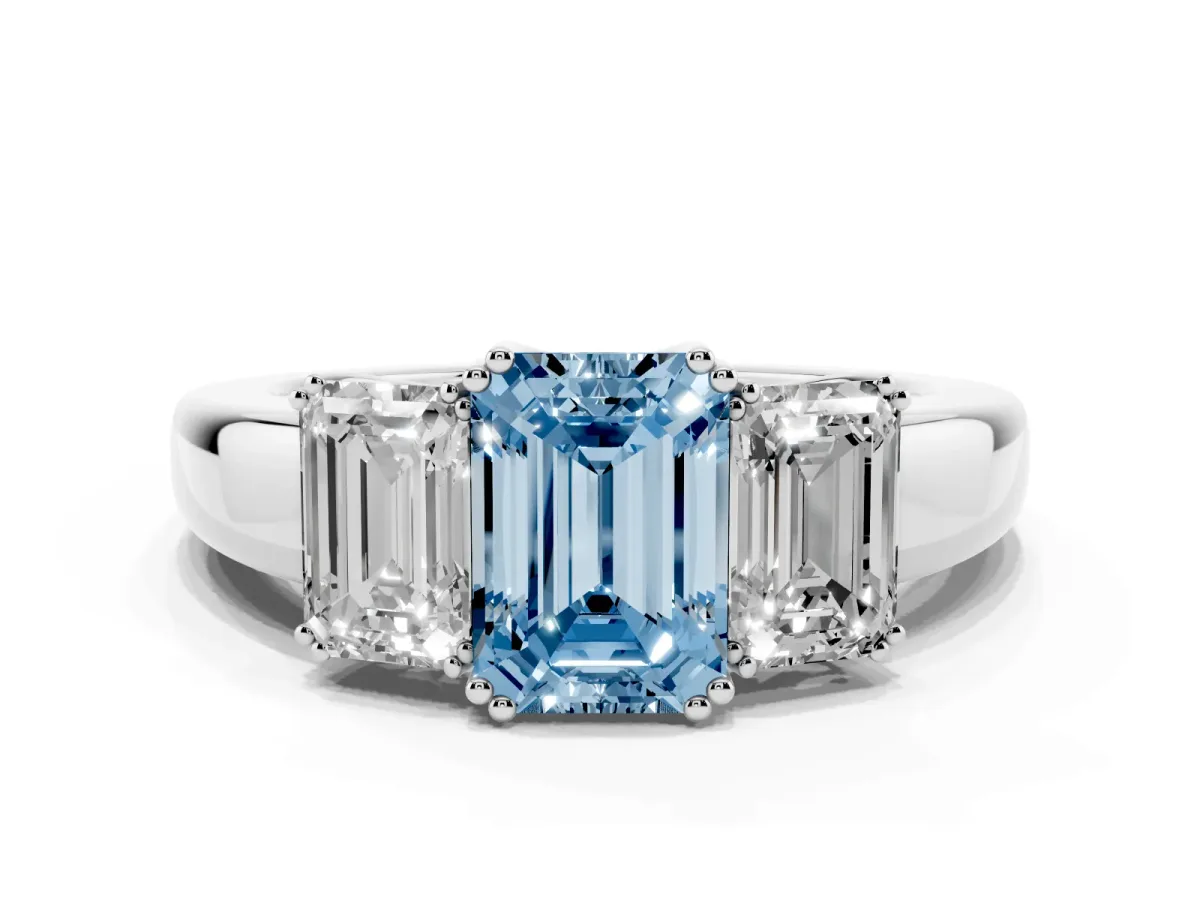 Fancy Blue Three-Stone Emerald Cut Cut Diamond Ring with Channel Set Band and Four-Prong Setting Silver