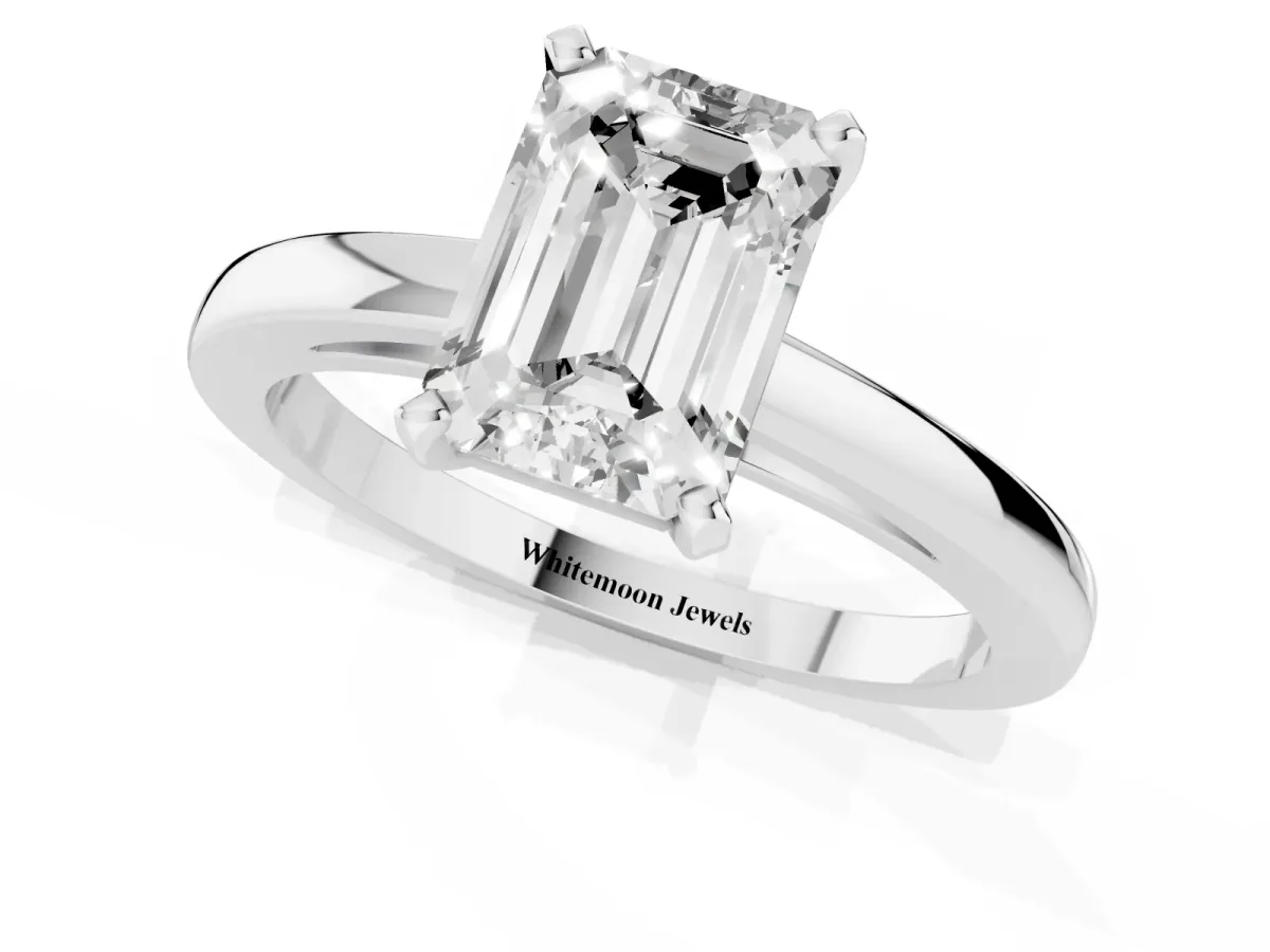 Emerald Cut Solitaire Diamond Engagement Ring with Four-Prong Setting on a Classic Band Silver