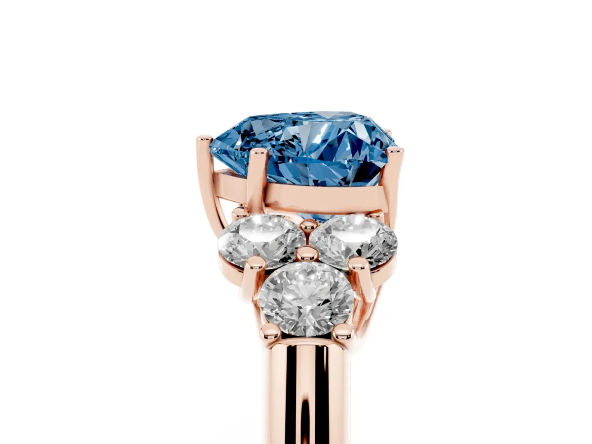 Fancy Blue Heart Cut Cut Diamond Cluster Ring with Round Accent Stones and Prong Setting on a Classic Band Rose gold