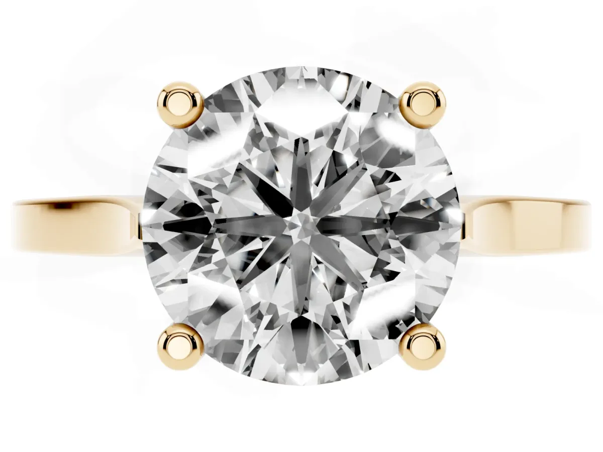 Round Cut Solitaire Diamond Ring with Four-Prong Setting and Tapered Band Yellow gold