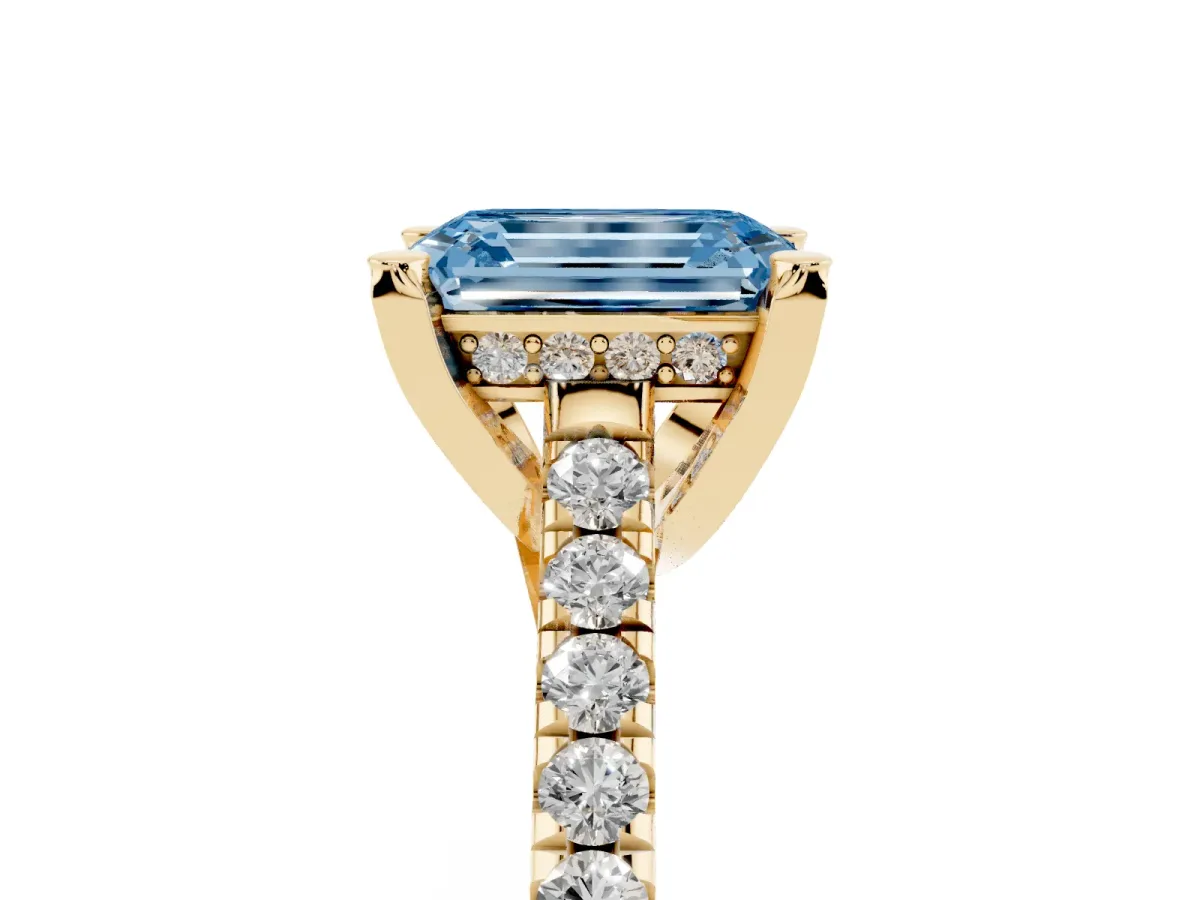 Fancy Blue Emerald Cut Brilliant Diamond Solitaire with Pavé Band and Four-Prong Setting Yellow gold