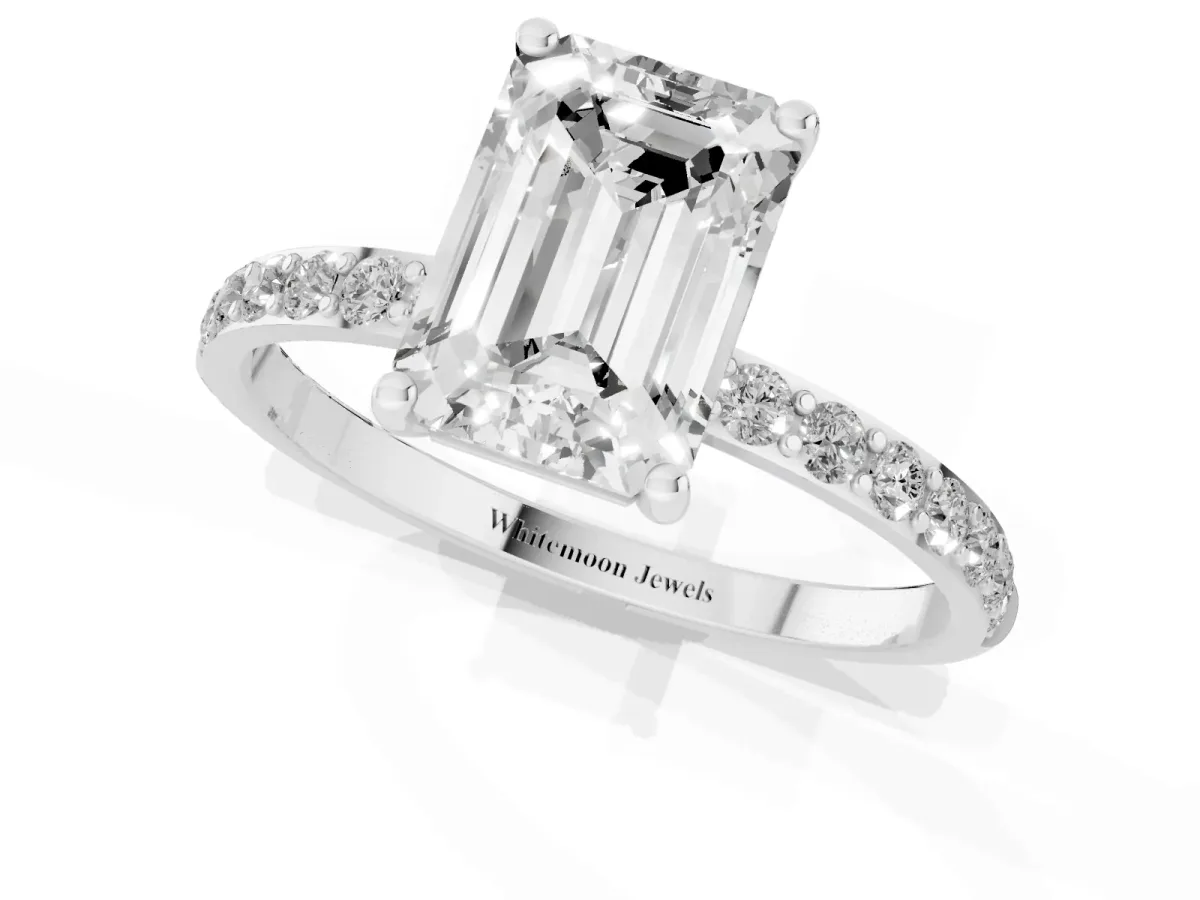 Emerald Cut Diamond Solitaire Ring with Round Pavé Shoulders and Prong Setting Silver