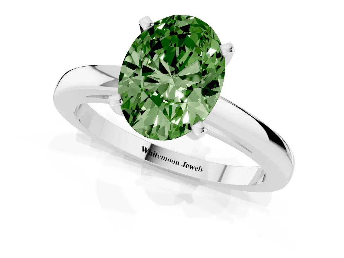 Fancy Green Oval Cut Solitaire Diamond Engagement Ring with Four-Prong Setting on a Classic Band Silver