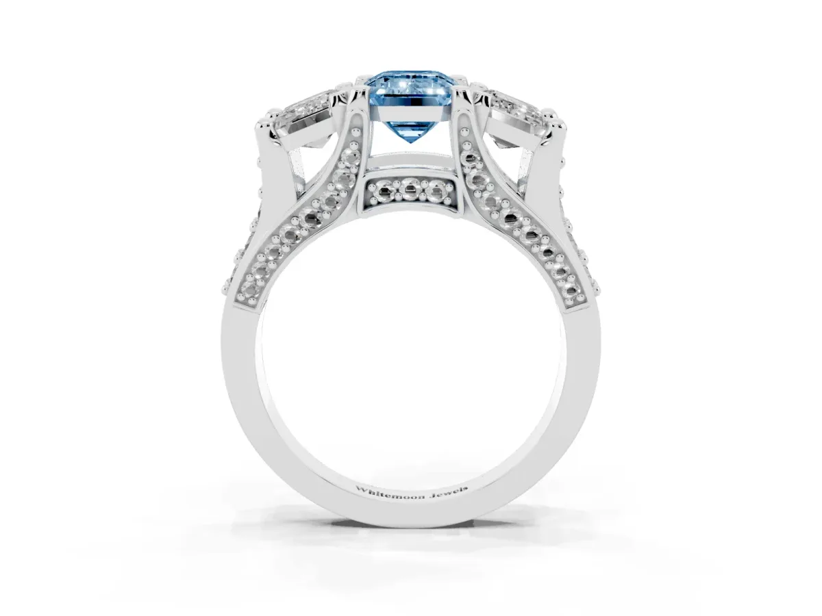 Fancy Blue Emerald Cut Diamond Three-Stone Ring with Channel Set Band and Four-Prong Setting Silver