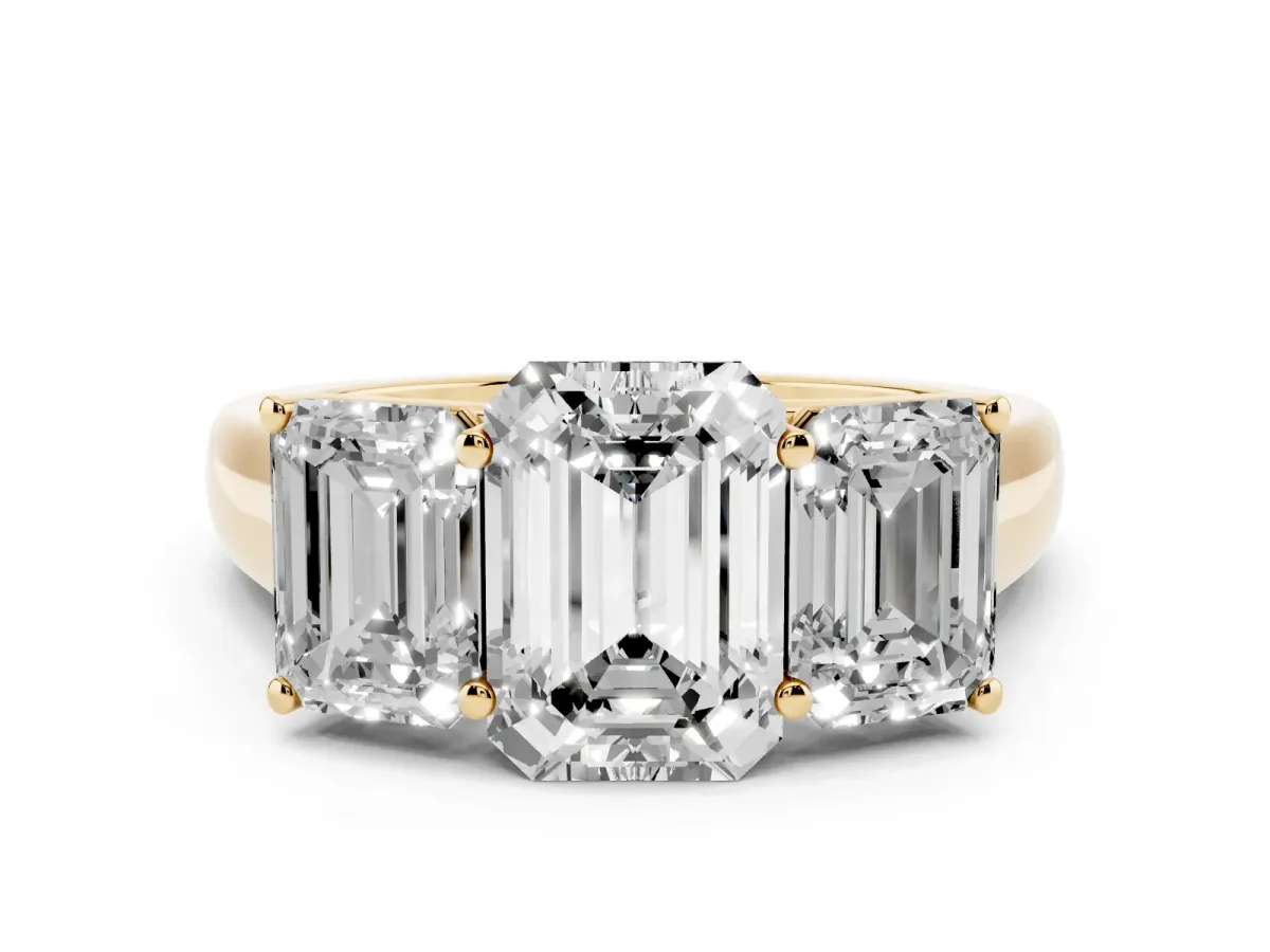 Emerald Cut Three-Stone Diamond Ring with Prong Setting on a Classic Band Yellow gold