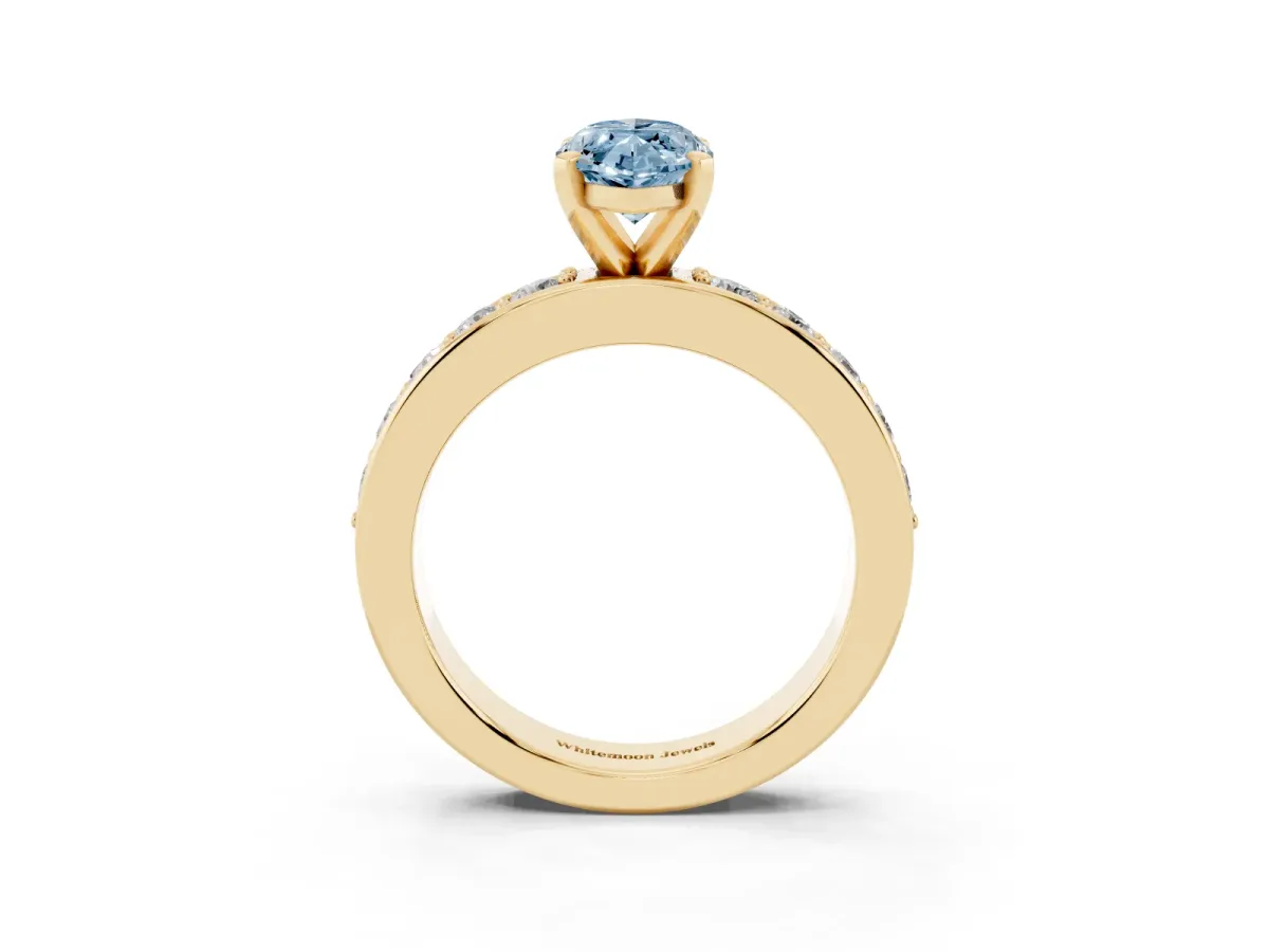 Fancy Blue Marquise Cut Diamond Engagement Ring with Channel Set Round Band and Prong Setting Yellow gold