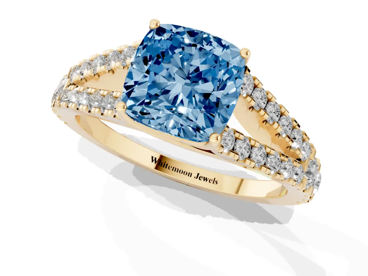 Fancy Blue Cushion Cut Diamond Split Shank Pavé Engagement Ring with Four-Prong Setting Yellow gold