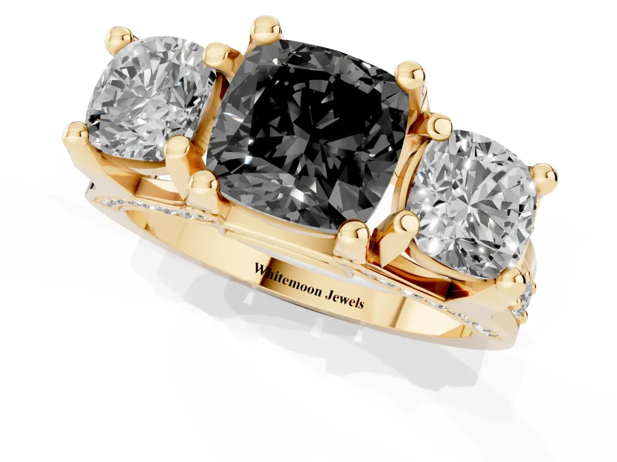 Fancy Black Cushion Cut Diamond Three-Stone Ring with Channel Set Band and Four-Prong Setting Yellow gold