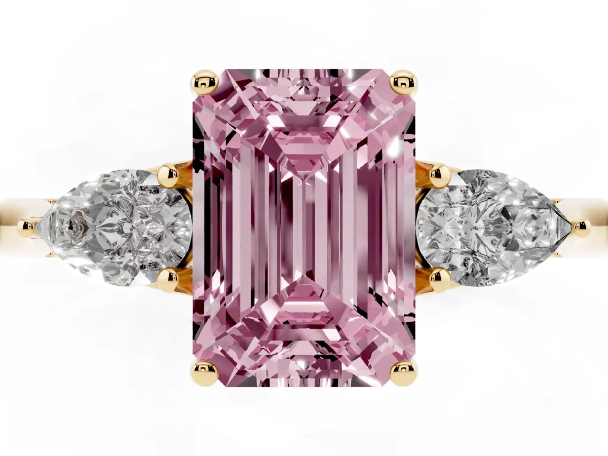 Fancy Pink Three-Stone Emerald Cut Brilliant Diamond Solitaire Ring with Tapered Band and Four-Prong Setting Yellow gold