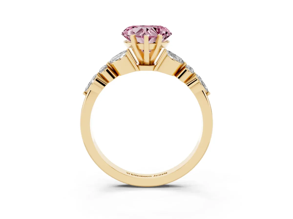 Fancy Pink Heart Cut Diamond Solitaire Ring with Side Stones and Four-Prong Setting Yellow gold