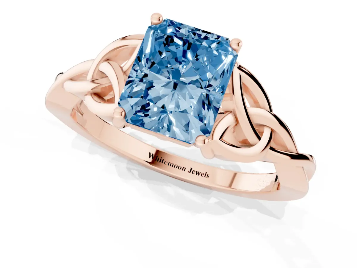 Fancy Blue Radiant Cut Diamond Solitaire Engagement Ring with Celtic Knot Band and Four-Prong Setting Rose gold