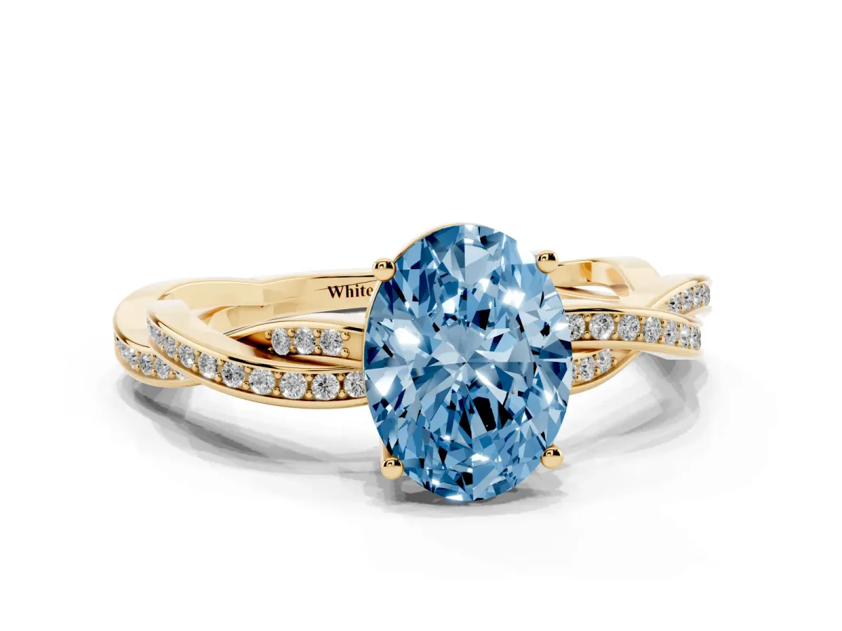 Fancy Blue Oval Cut Solitaire Twisted Pave Diamond Ring with Four-Prong Setting Yellow gold