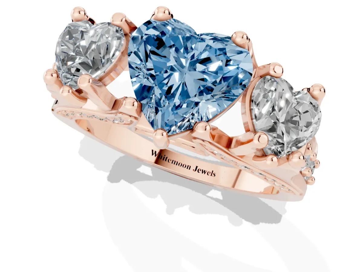 Fancy Blue Heart Cut Diamond Three-Stone Ring with Channel Set Band and Four-Prong Setting Rose gold