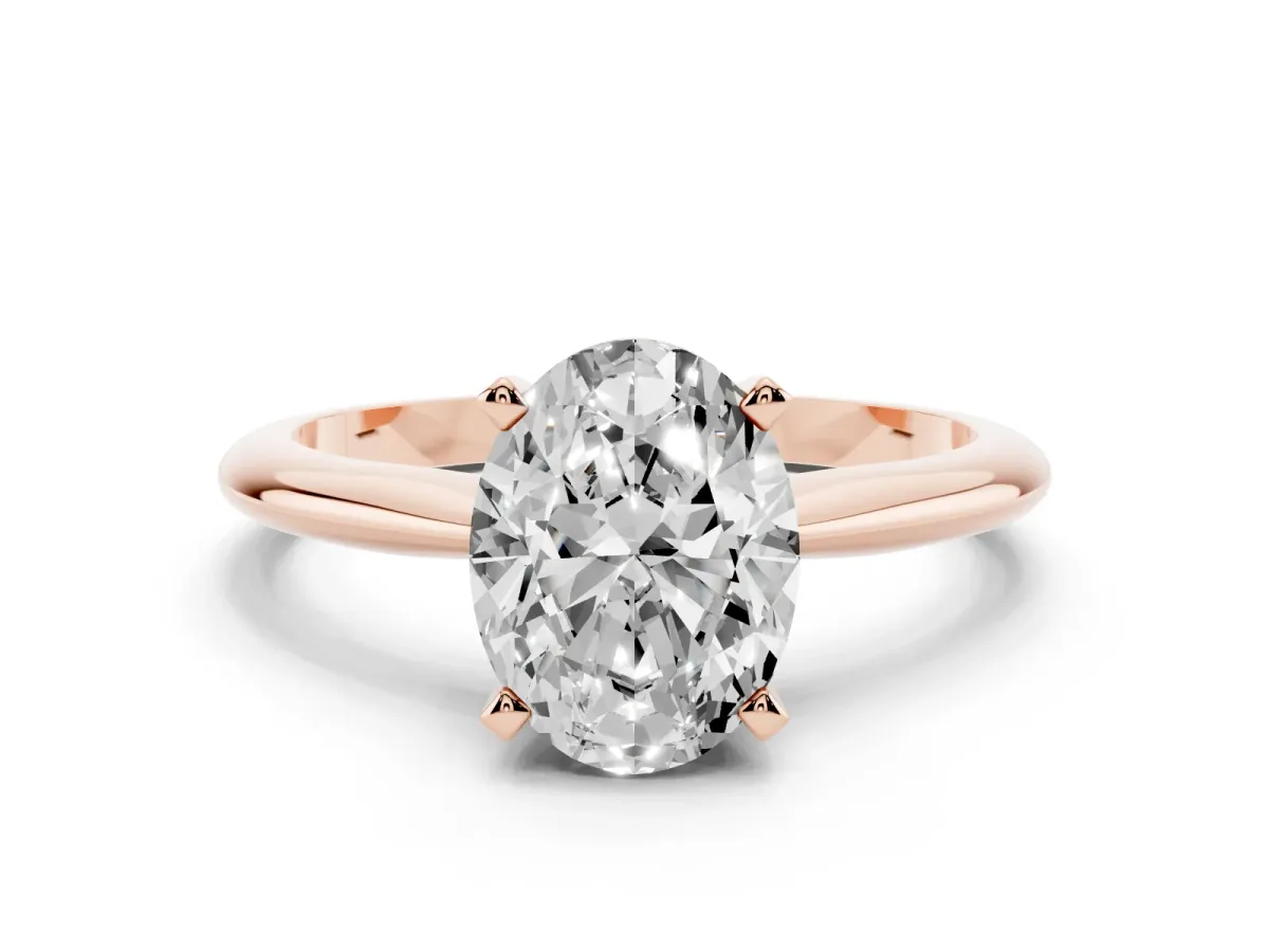 Oval Cut Cut Solitaire Ring with Four-Prong Setting on a Classic Band Rose gold