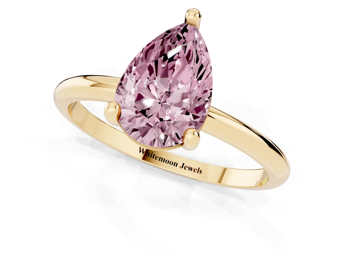 Fancy Pink Pear Cut Solitaire Diamond Ring with 4-Prong Setting on a Classic Band Yellow gold