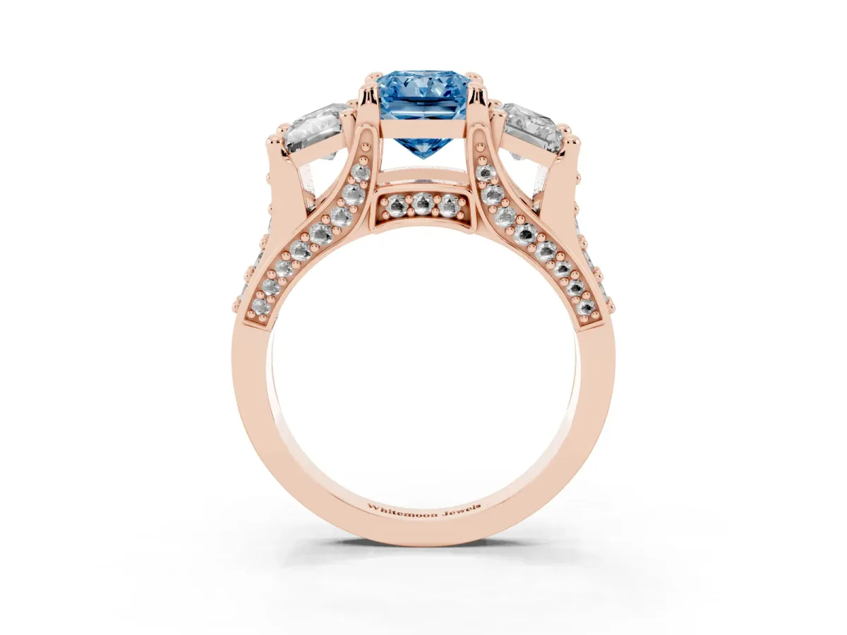 Fancy Blue Radiant Cut Diamond Three-Stone Ring with Channel Set Band and Four-Prong Setting Rose gold