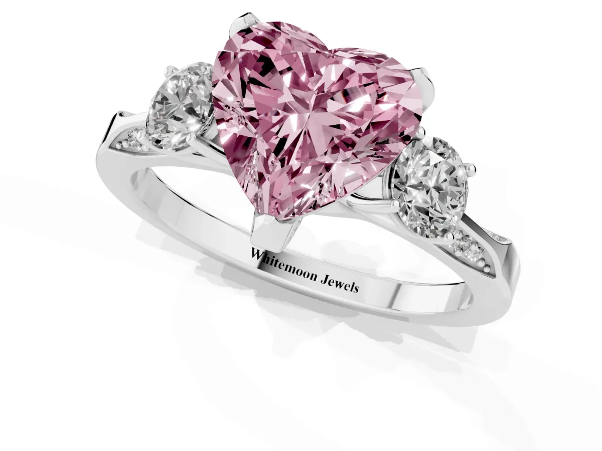 Fancy Pink Heart Cut Brilliant Three-Stone Diamond Ring with Pavé Band and Four-Prong Setting White gold