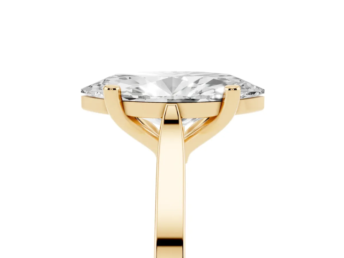 Marquise Cut Solitaire Diamond Ring with Four-Prong Setting and Tapered Band Yellow gold