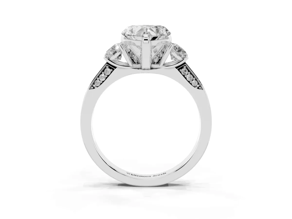 Heart Cut Brilliant Three-Stone Diamond Ring with Pavé Band and Four-Prong Setting Platinum