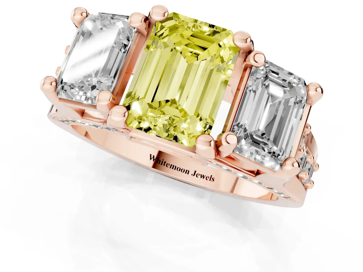 Fancy Yellow Emerald Cut Diamond Three-Stone Ring with Channel Set Band and Four-Prong Setting Rose gold