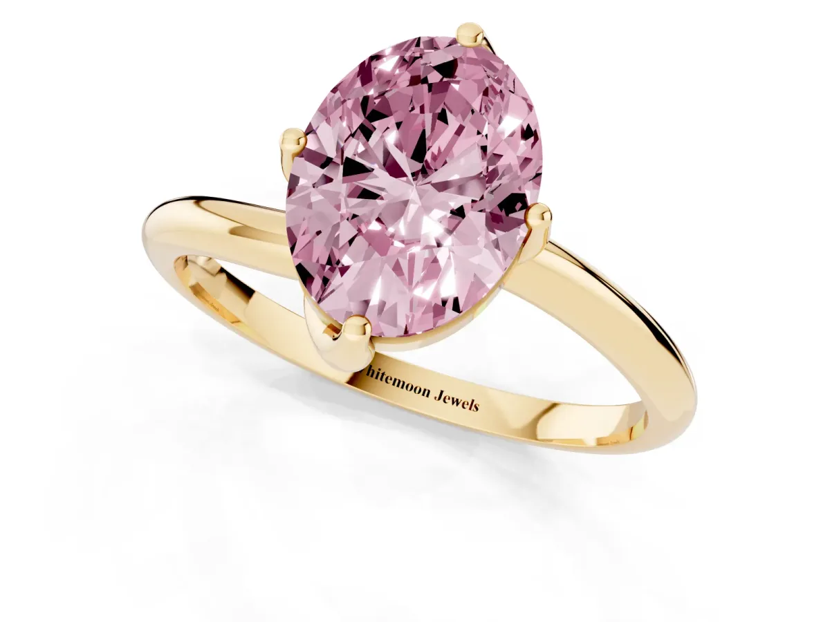 Fancy Pink Oval Cut Diamond Solitaire Engagement Ring with Four-Prong Setting and Classic Band Yellow gold