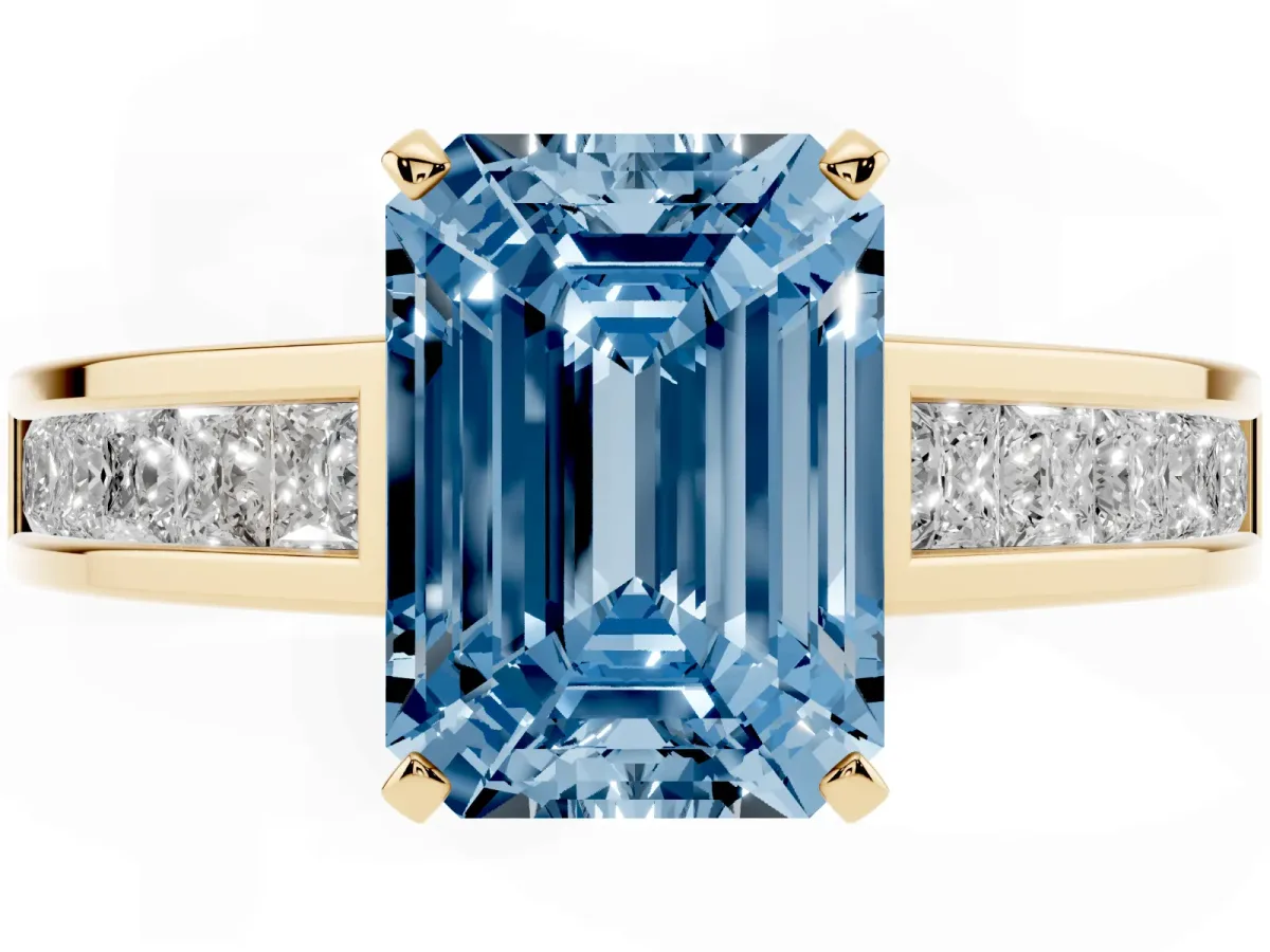Fancy Blue Emerald Cut Solitaire Diamond Ring with Channel-Set Band and Four-Prong Setting Yellow gold