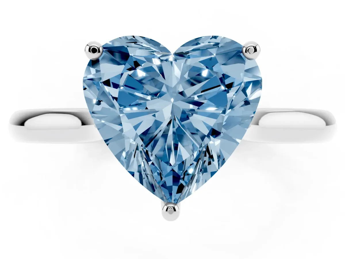 Fancy Blue Heart Cut Cut Solitaire Ring with Cathedral Band and Four-Prong Setting Silver