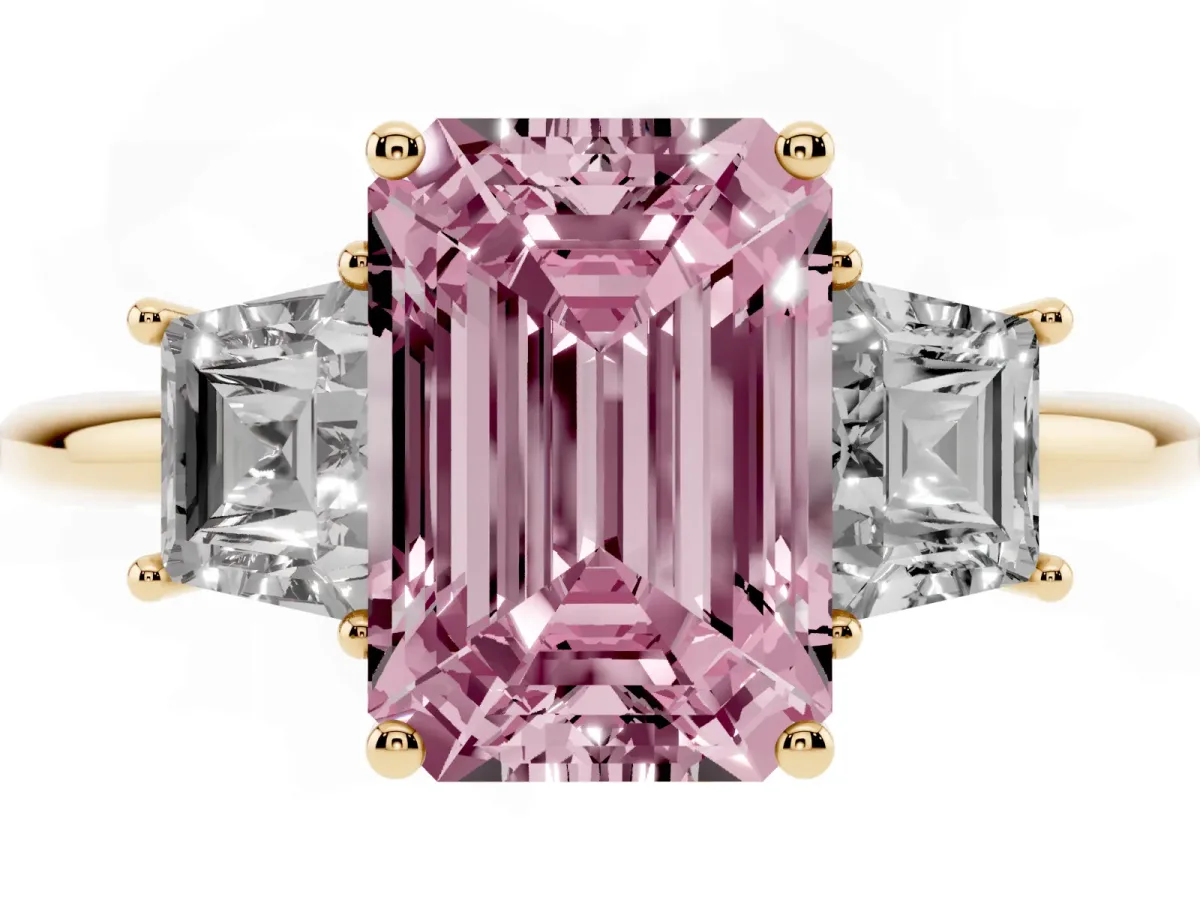 Fancy Pink Emerald Cut Diamond Three-Stone Ring with Trapezoid Side Stones and Prong Setting Yellow gold