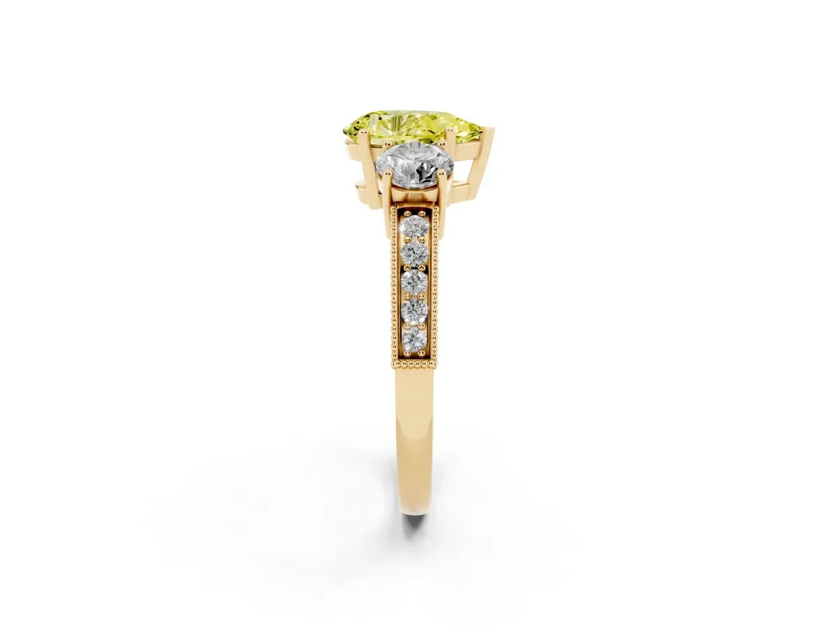 Fancy Yellow Pear Cut Three-Stone Diamond Ring with Pavé Band and Four-Prong Setting Yellow gold