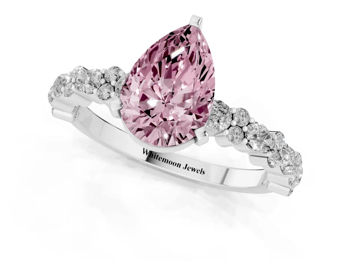 Fancy Pink Pear Cut Diamond Side Stone Solitaire Ring with Round and Four-Prong Setting Silver
