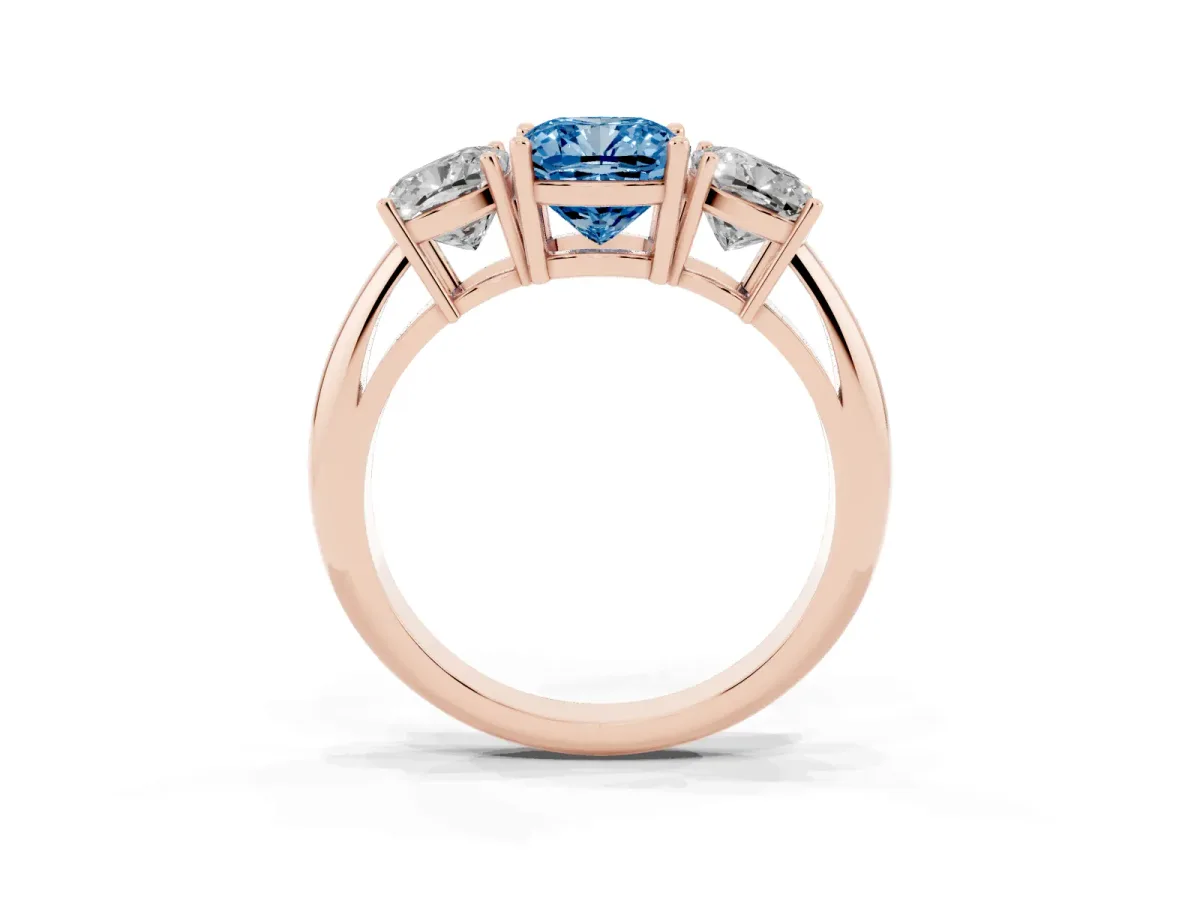 Fancy Blue Three-Stone Cushion Cut Cut Diamond Engagement Ring with Prong Setting on a White Gold Band Rose gold