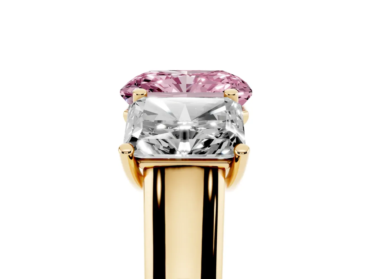 Fancy Pink Radiant Cut Three-Stone Diamond Ring with Prong Setting on a Classic Band Yellow gold