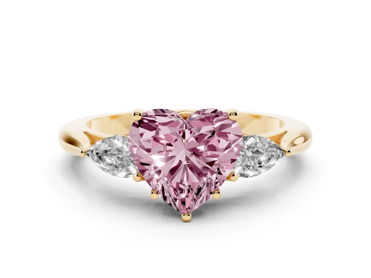 Fancy Pink Three-Stone Heart Cut Diamond Ring with Pear Side Stones in Four-Prong Setting Yellow gold