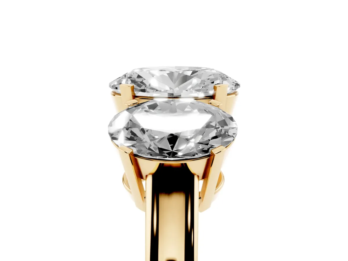 Three-Stone Oval Cut Cut Diamond Ring with Channel Set Band and Four-Prong Setting Yellow gold