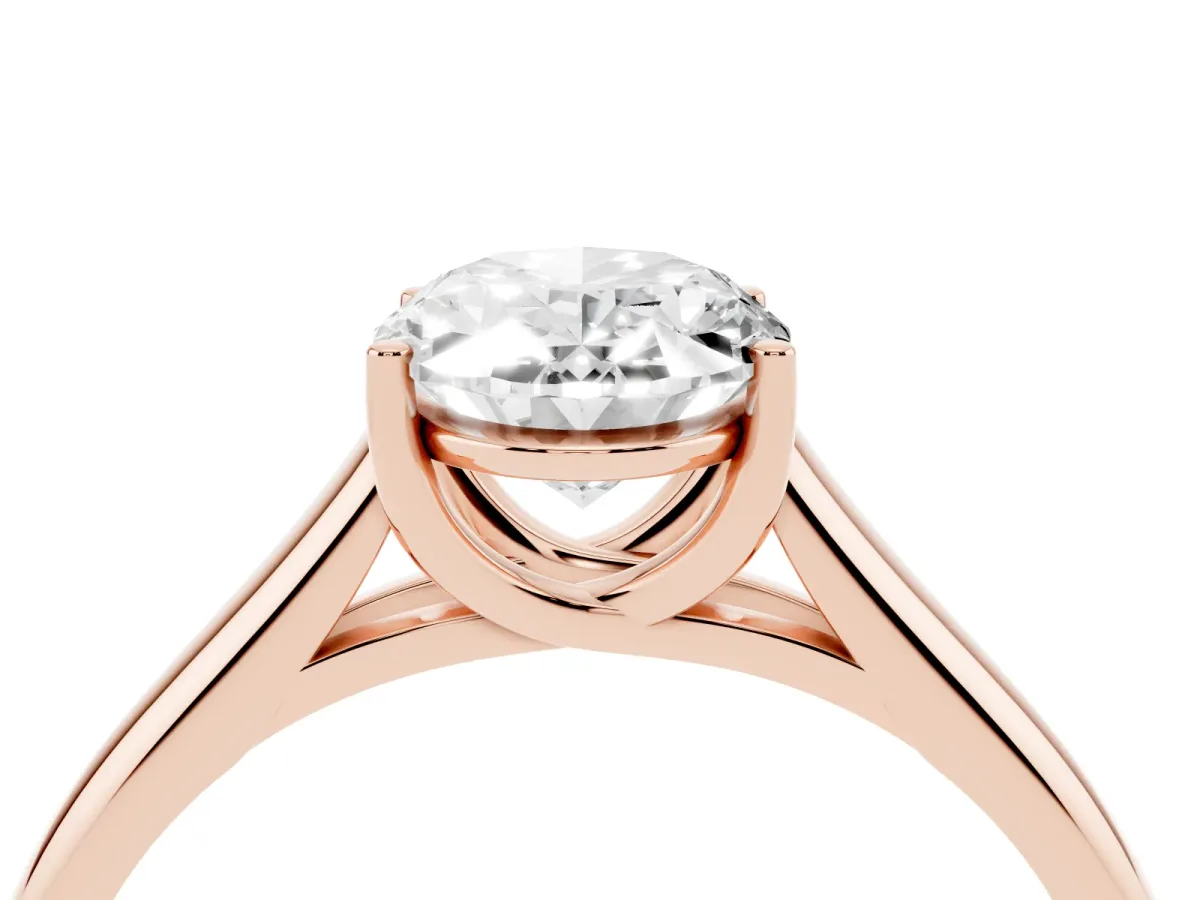 Oval Cut Solitaire Engagement Ring with Tapered Band and Four-Prong Setting Rose gold