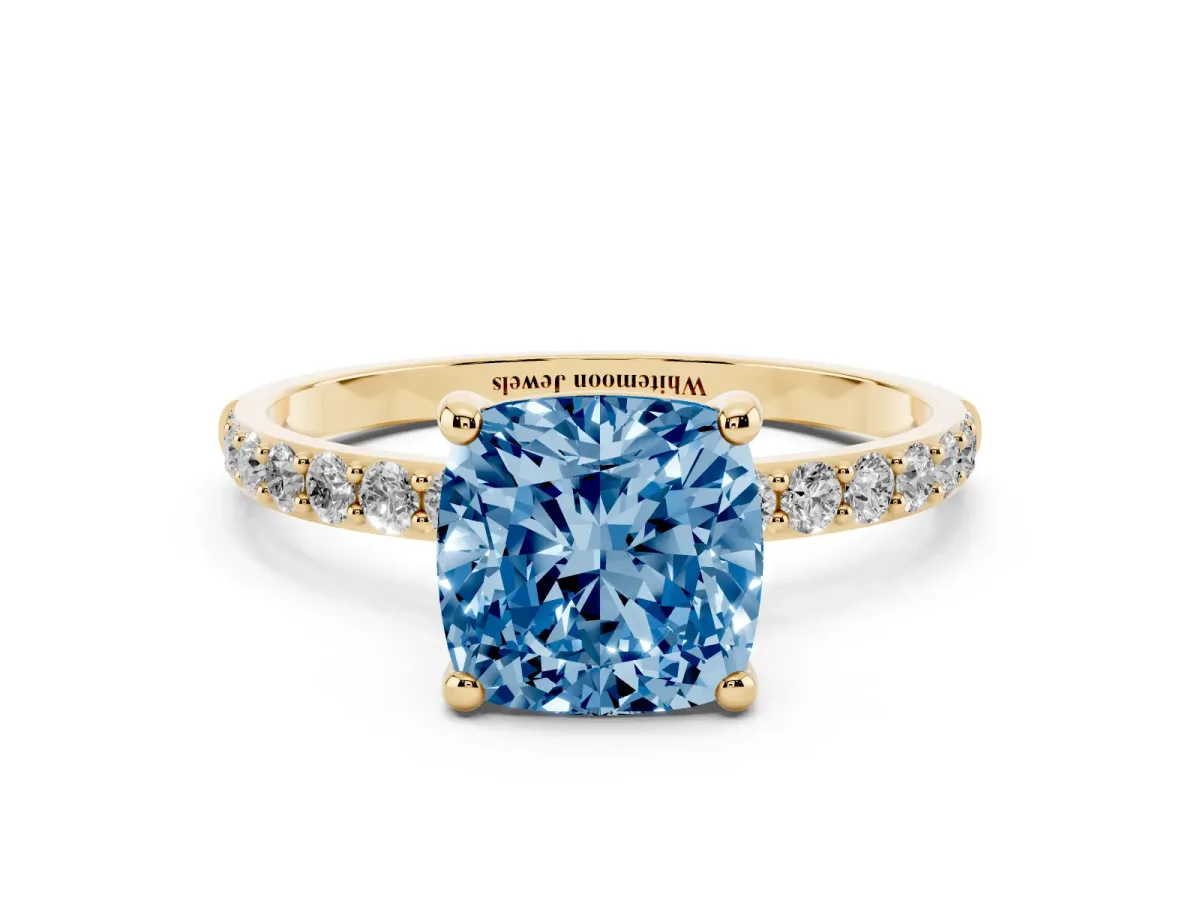 Fancy Blue Cushion Cut Diamond Solitaire Ring with Round Pavé Band and Prong Setting Yellow gold