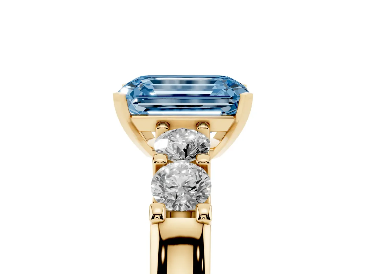 Fancy Blue Emerald Cut Brilliant Cut Diamond Five-Stone Prong Set Engagement Ring with Channel Band Yellow gold