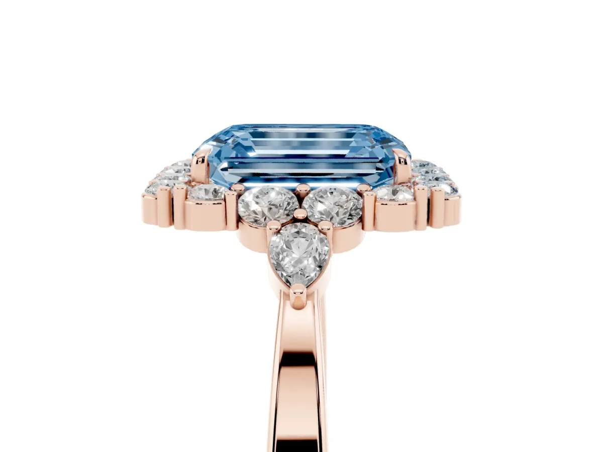 Fancy Blue Emerald Cut Diamond Halo Ring with Pear Side Stones and Prong Setting Rose gold