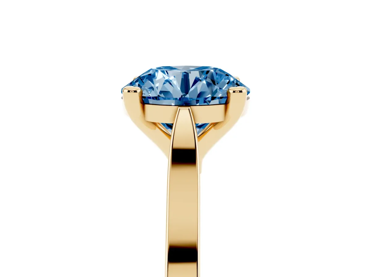 Fancy Blue Round Cut Solitaire Diamond Ring with Four-Prong Setting and Tapered Band Yellow gold