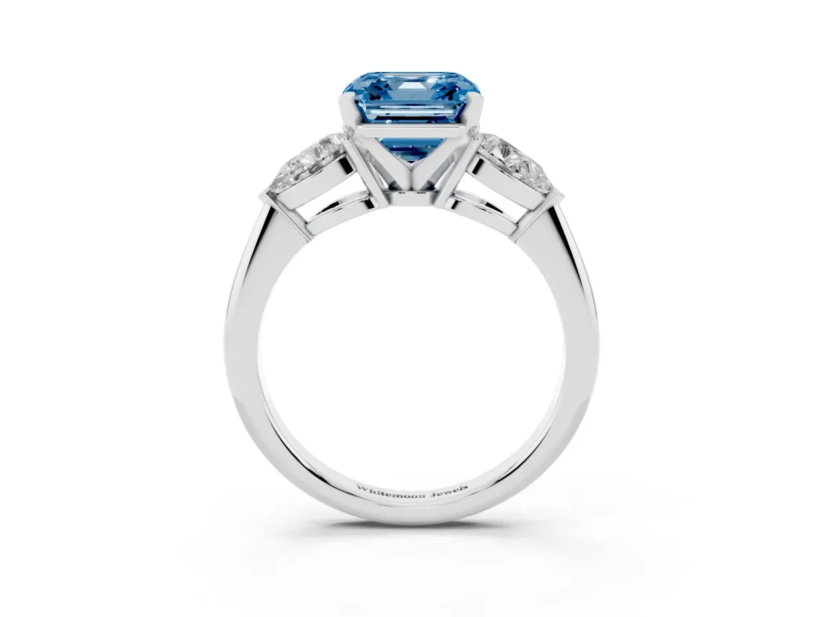 Fancy Blue Three-Stone Asscher Cut Diamond Ring with Pear Side Stones and Four-Prong Setting Platinum