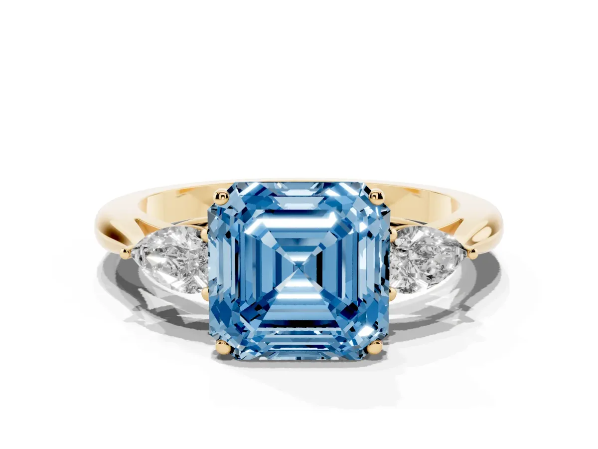 Fancy Blue Asscher Cut Diamond Three-Stone Ring with Pear Side Stones and Prong Setting Yellow gold