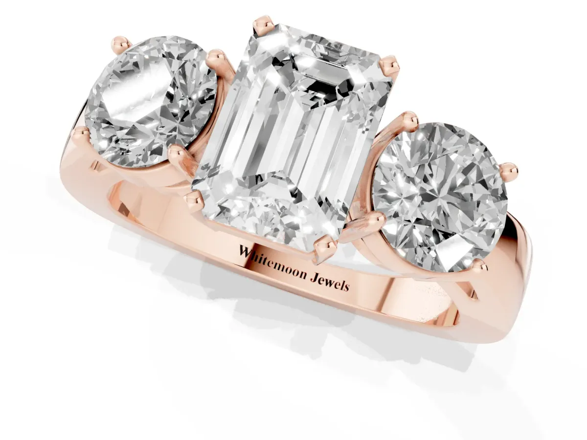 Three-Stone Emerald Cut Diamond Ring with Round Side Stones, Classic Band, and Four-Prong Setting Rose gold