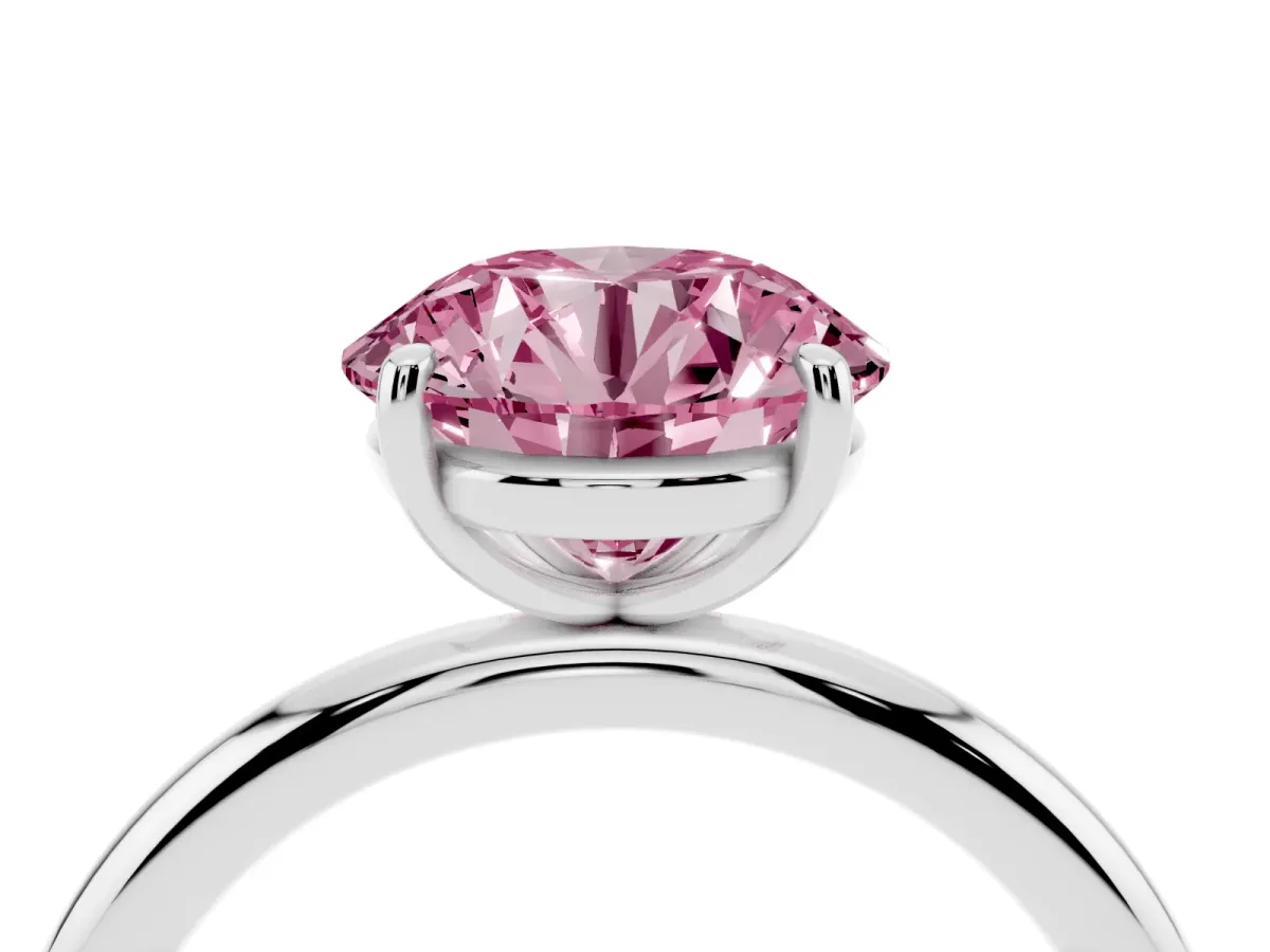 Fancy Pink Round Cut Solitaire Diamond Ring with Four-Prong Setting on a Plain Band Platinum