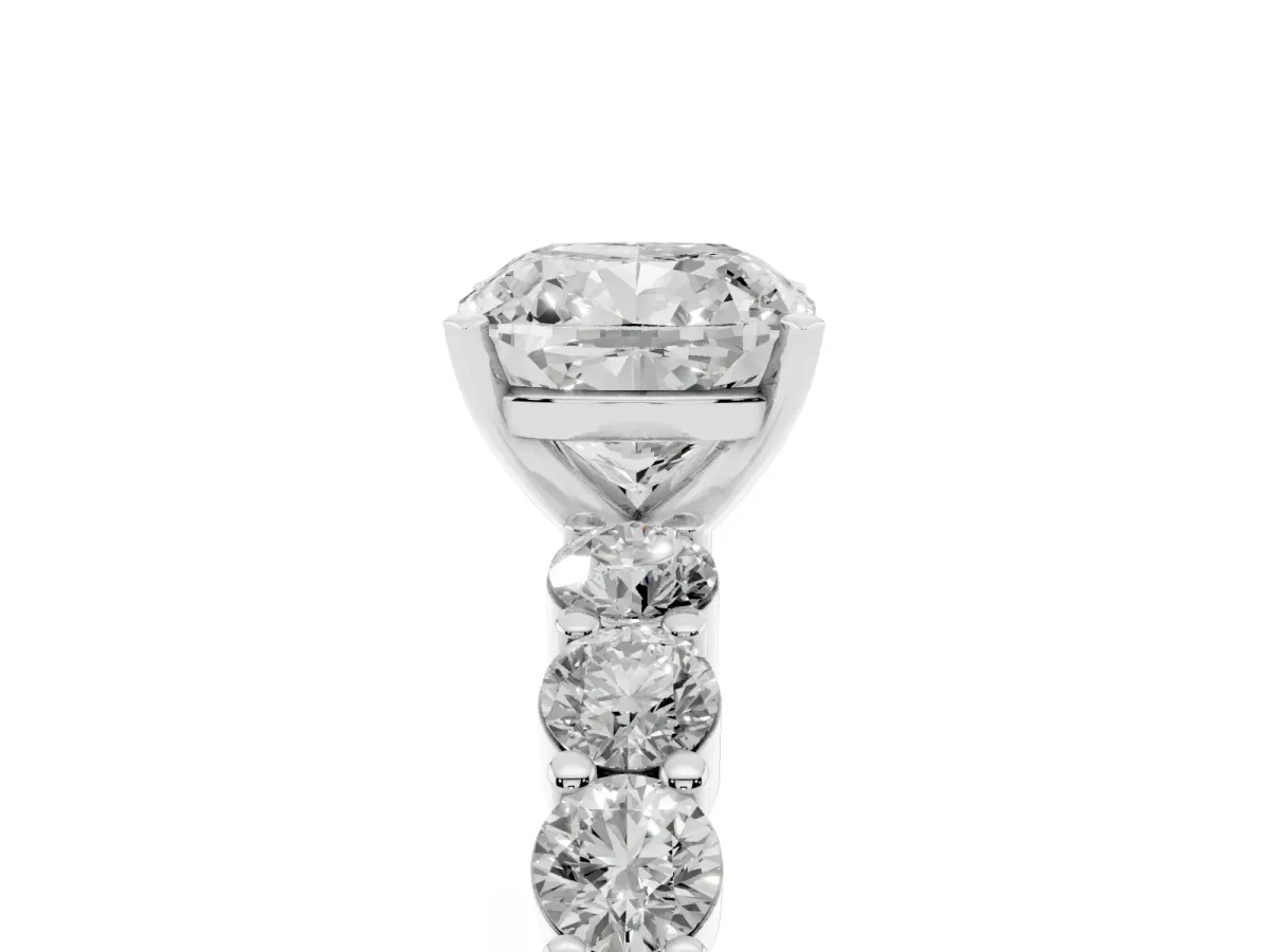 Cushion Cut Diamond Solitaire Ring with Shared Prong Round Side Stones Platinum