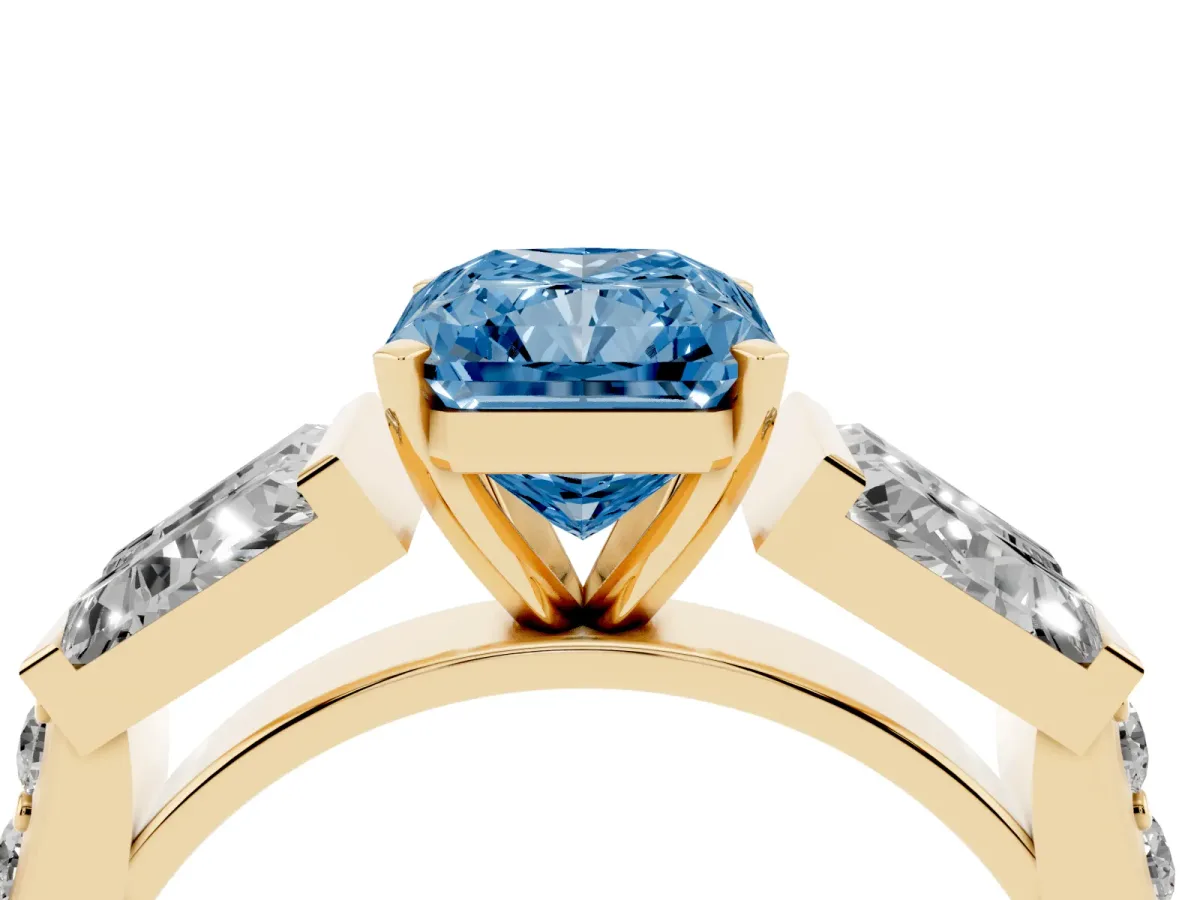Fancy Blue Radiant Cut Diamond Engagement Ring with Baguette Side Stones and Channel Set Band Yellow gold