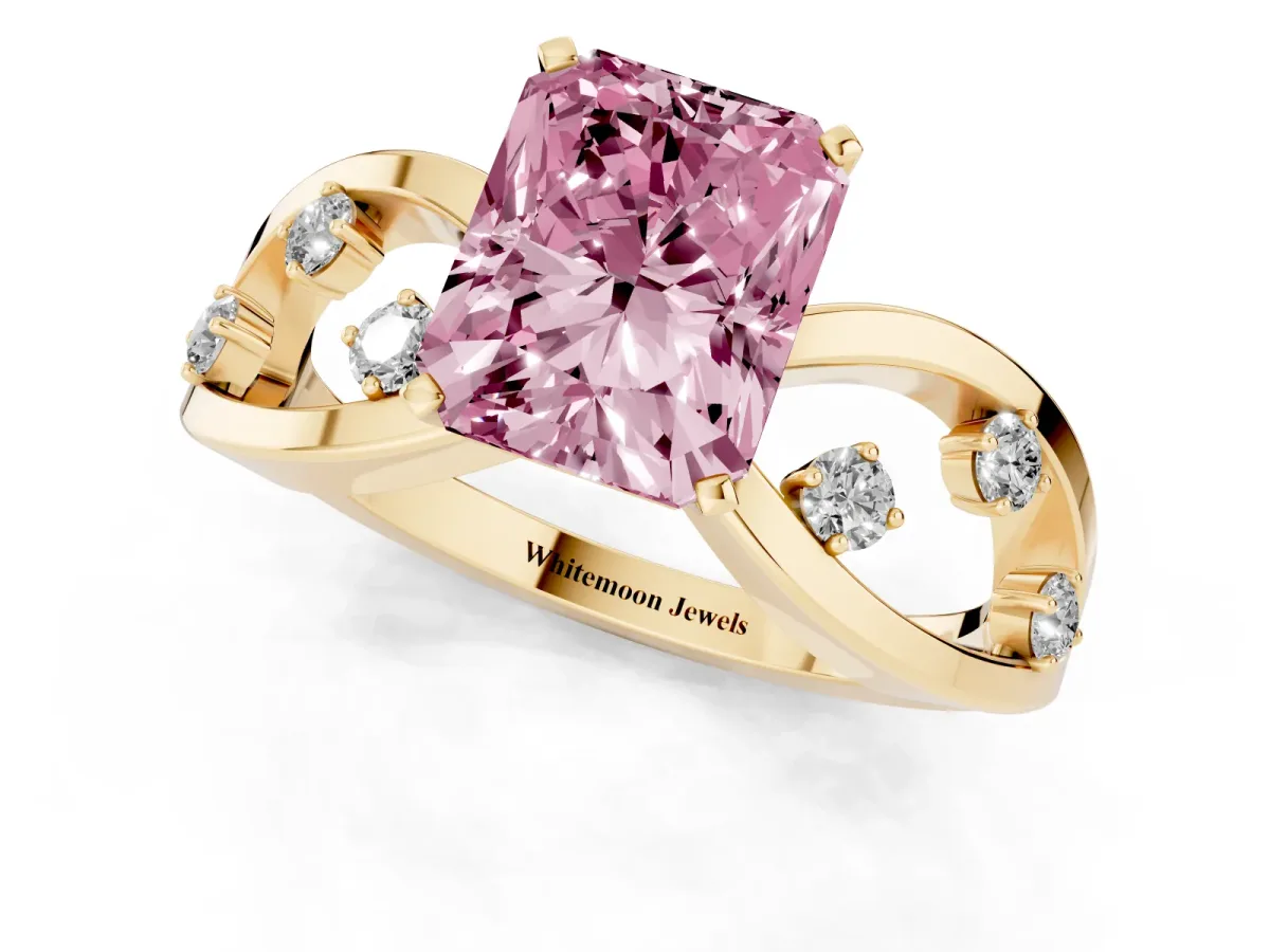 Fancy Pink Radiant Cut Cut Solitaire Diamond with Side Stones on Criss-Cross Band and Four-Prong Setting Yellow gold